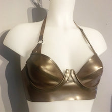 Styling of the latex plunge halter bra with underwires and adjustable strap