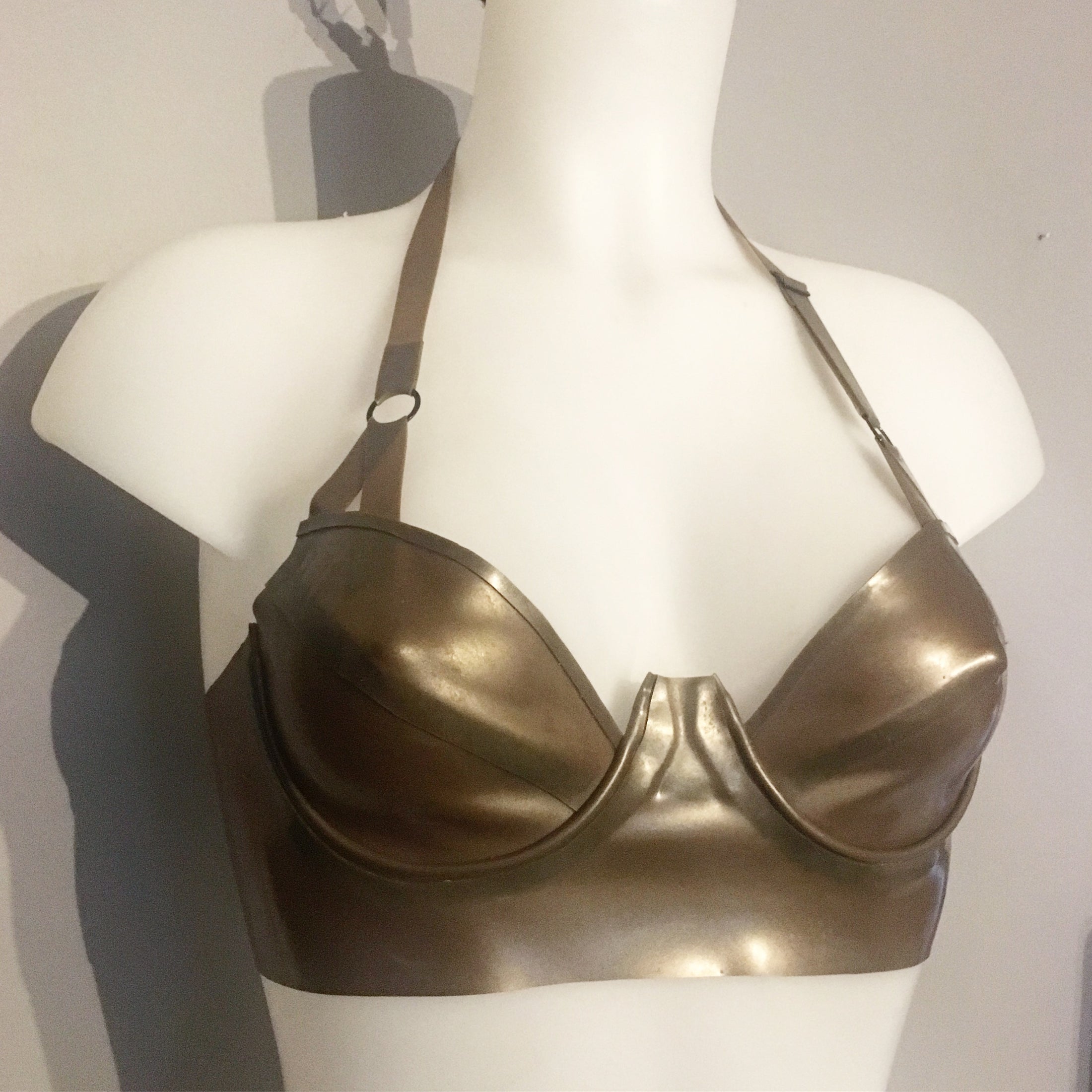 Styling of the latex plunge halter bra with underwires and adjustable strap