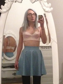 Detail of the swing and fit on the floaty latex skater mini skirt