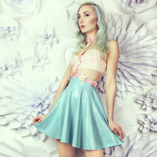 Close detail of the smooth latex finish on the skater mini skirt