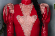 Detail of the custom harness styled with the high-neck Erato latex dress