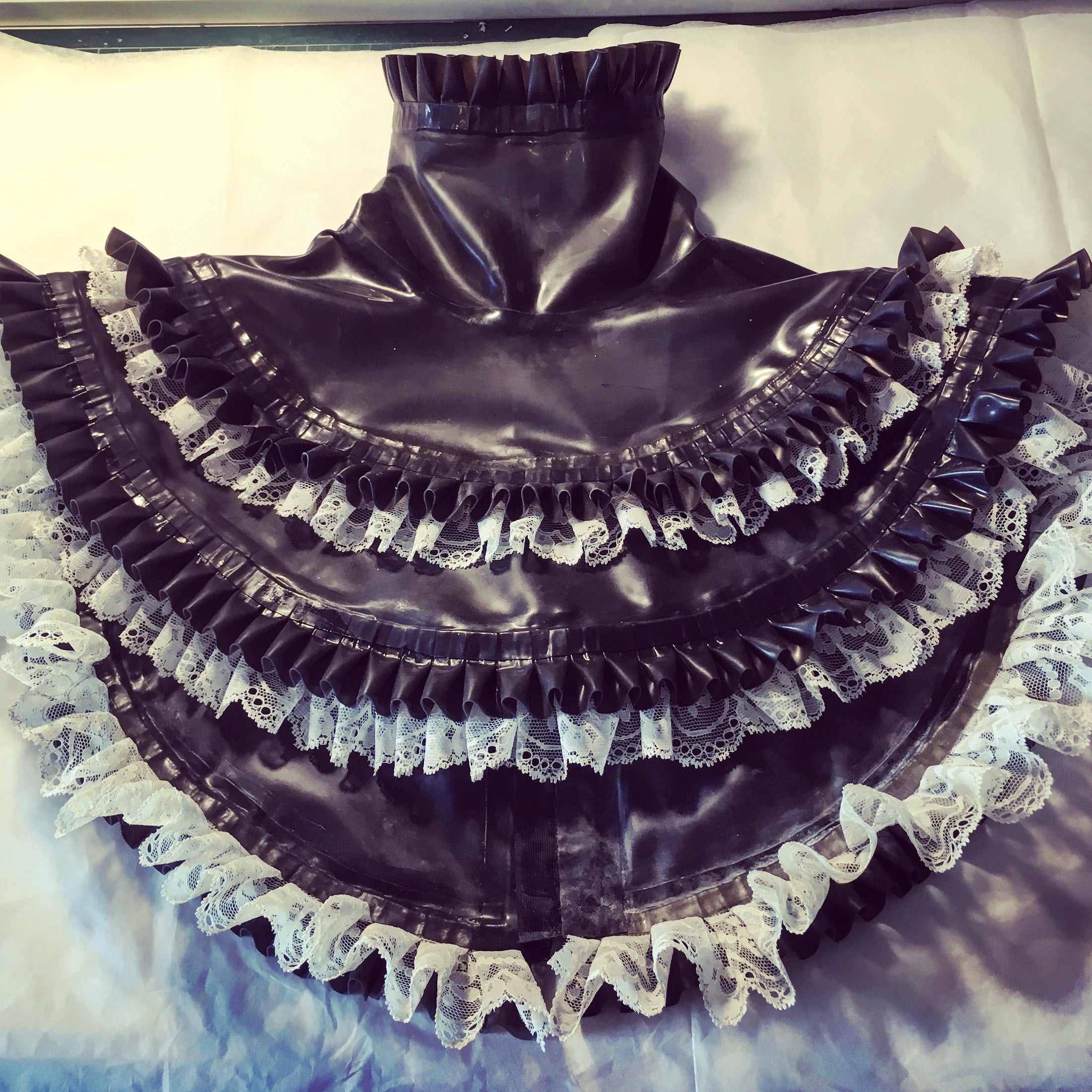 Detail of the double pleated latex and lace trim on the ruff collar