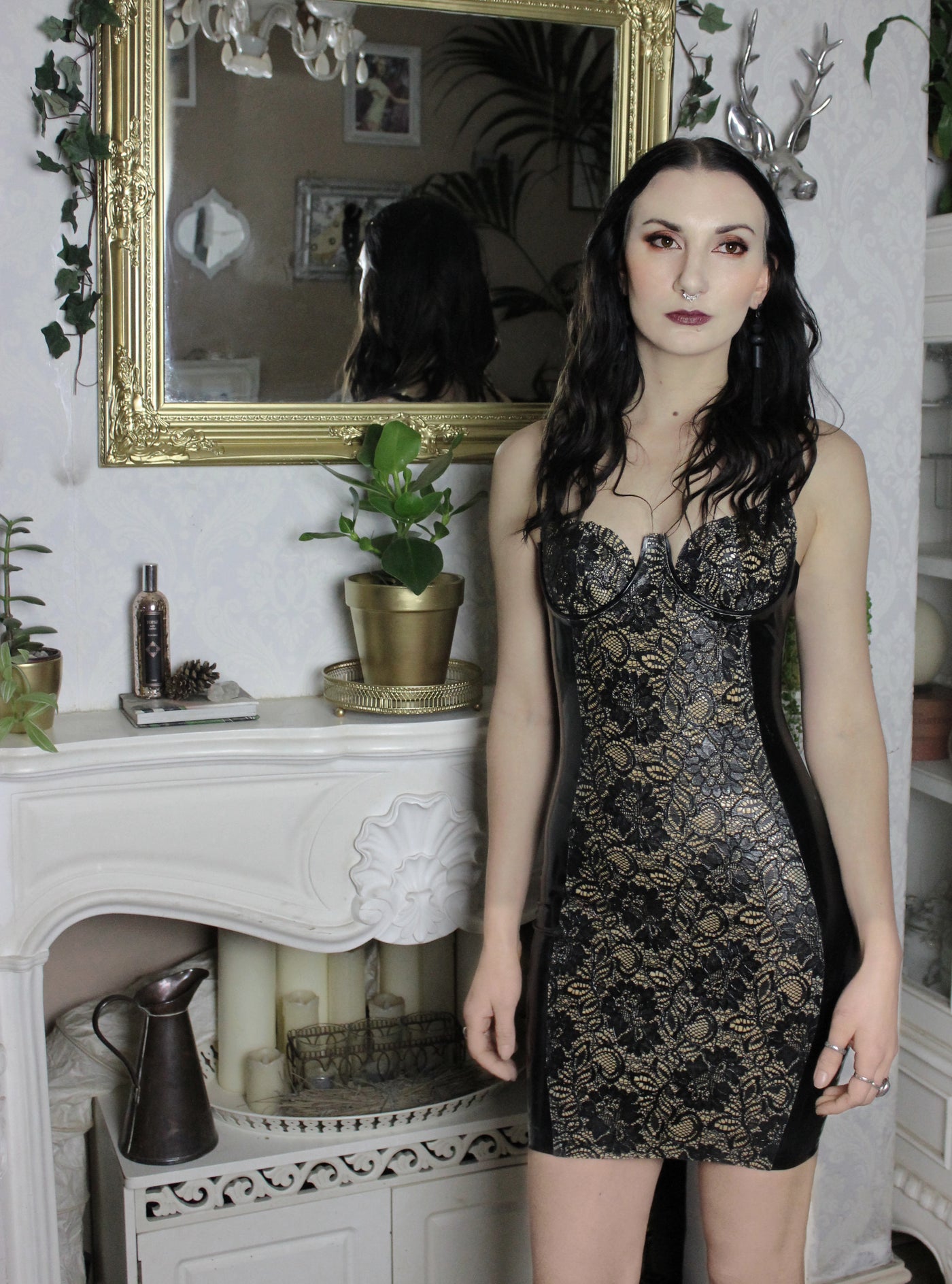 Detail of the signature latex-lace centre-front panel on the dress