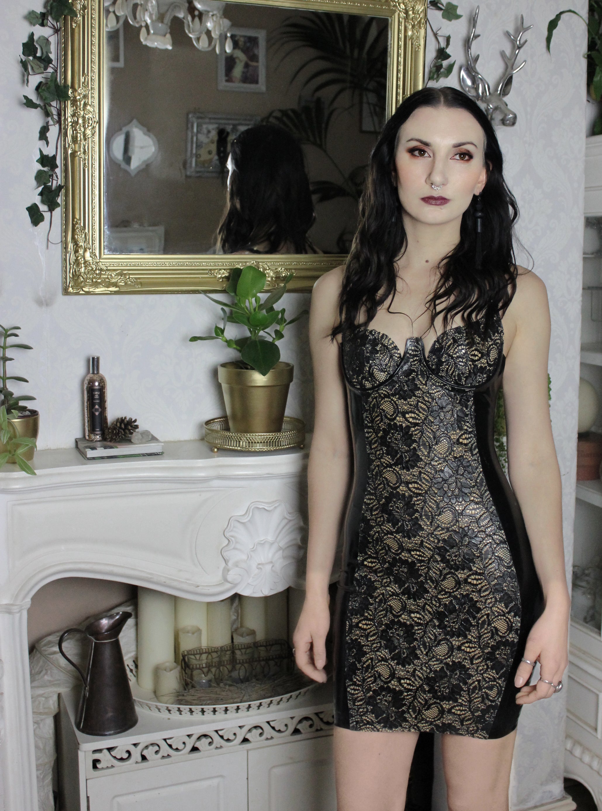 Detail of the signature latex-lace centre-front panel on the dress
