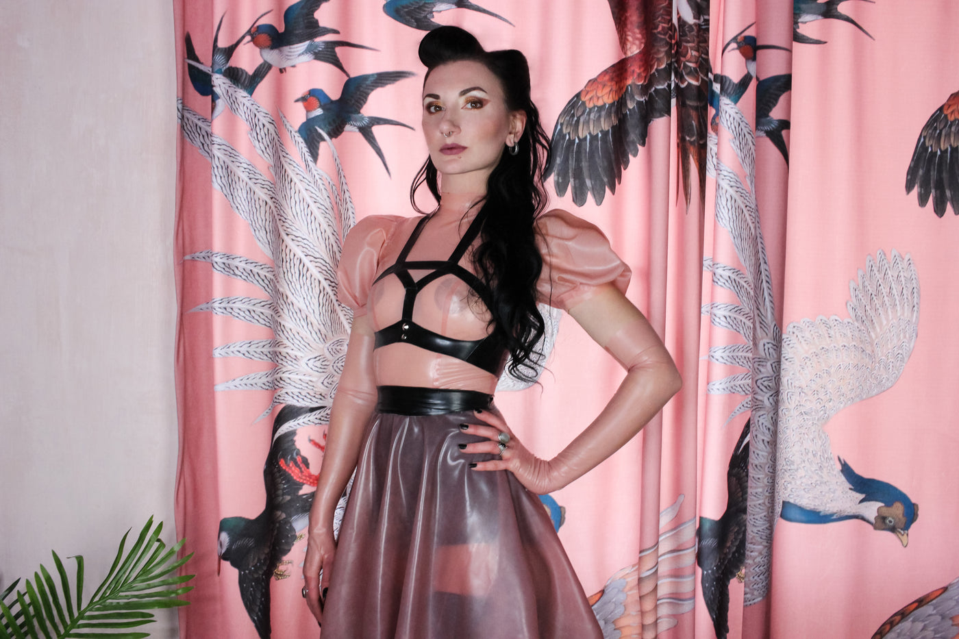 Detail of the puff sleeves on the feminine latex swing dress