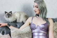 Detail of the adjustable straps and shaping on the curvy cup latex bra