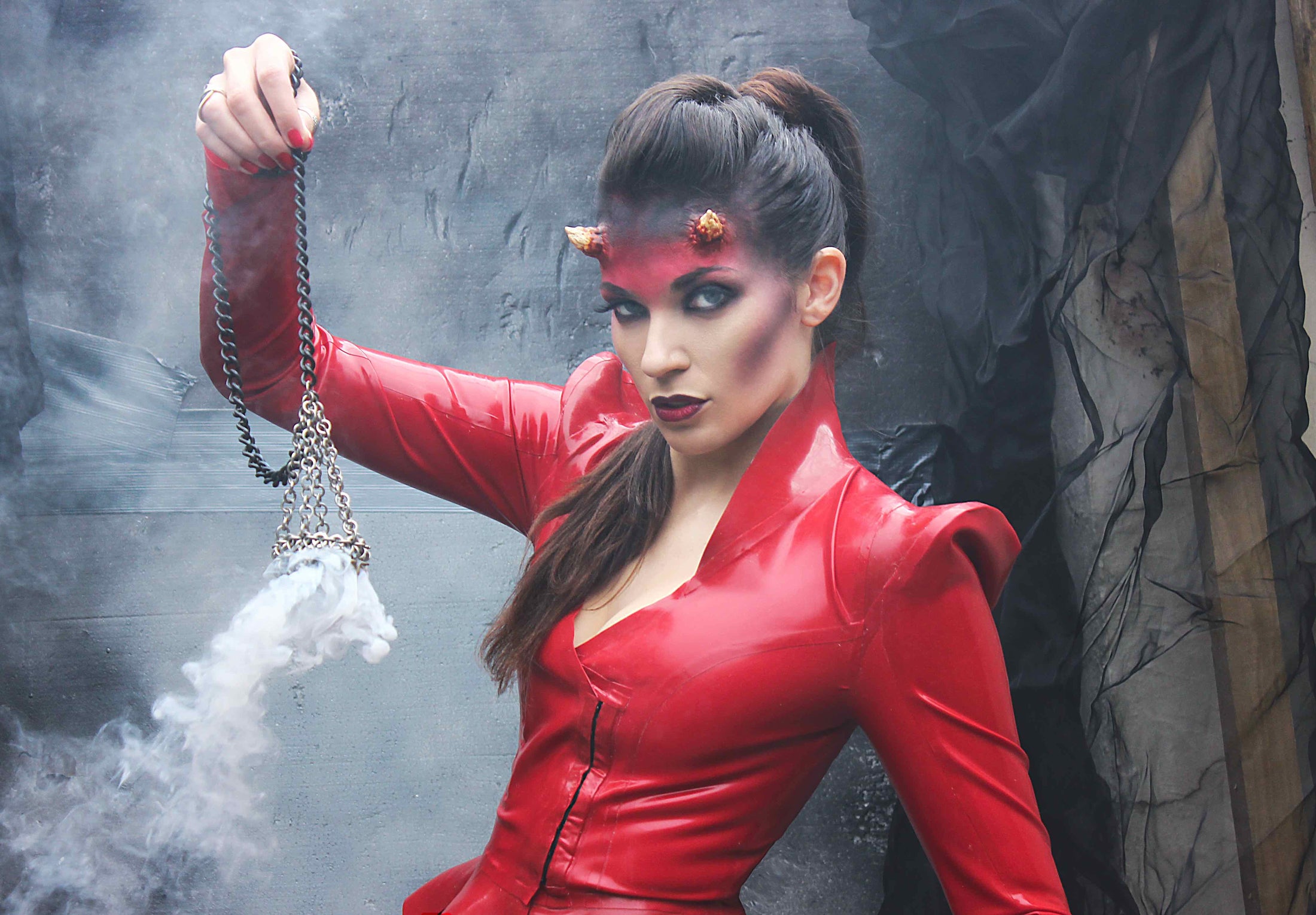Detail of the pointed two-piece sleeve on the fitted latex Sin jacket